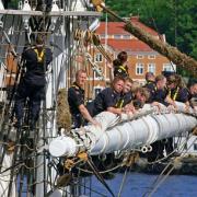 Many hands help out when the sails of tall ships are to be set, Stockholm, Sweden